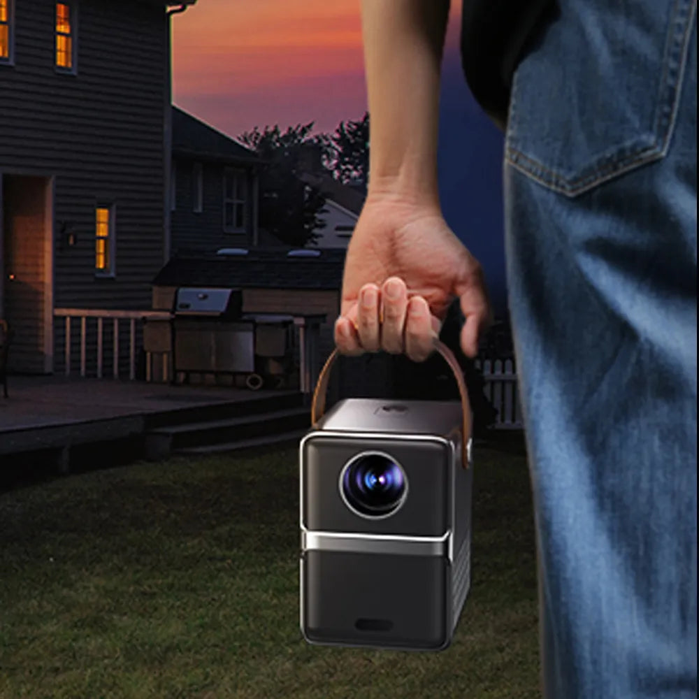 lunarys projector portable a person handling it 