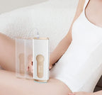 Person using a Kozenix IPL Hair Removal AS20 device on their abdomen with a neutral background