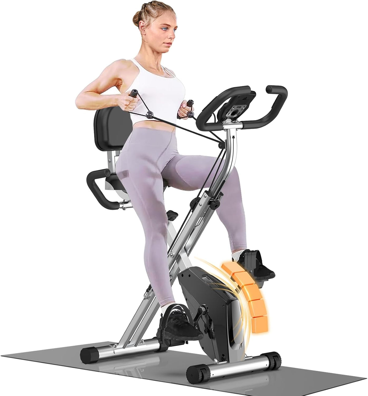 Woman exercising on a home fitness bike with a white background